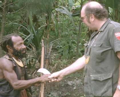 Milt shaking hands with native in the New Guinea Highlands.